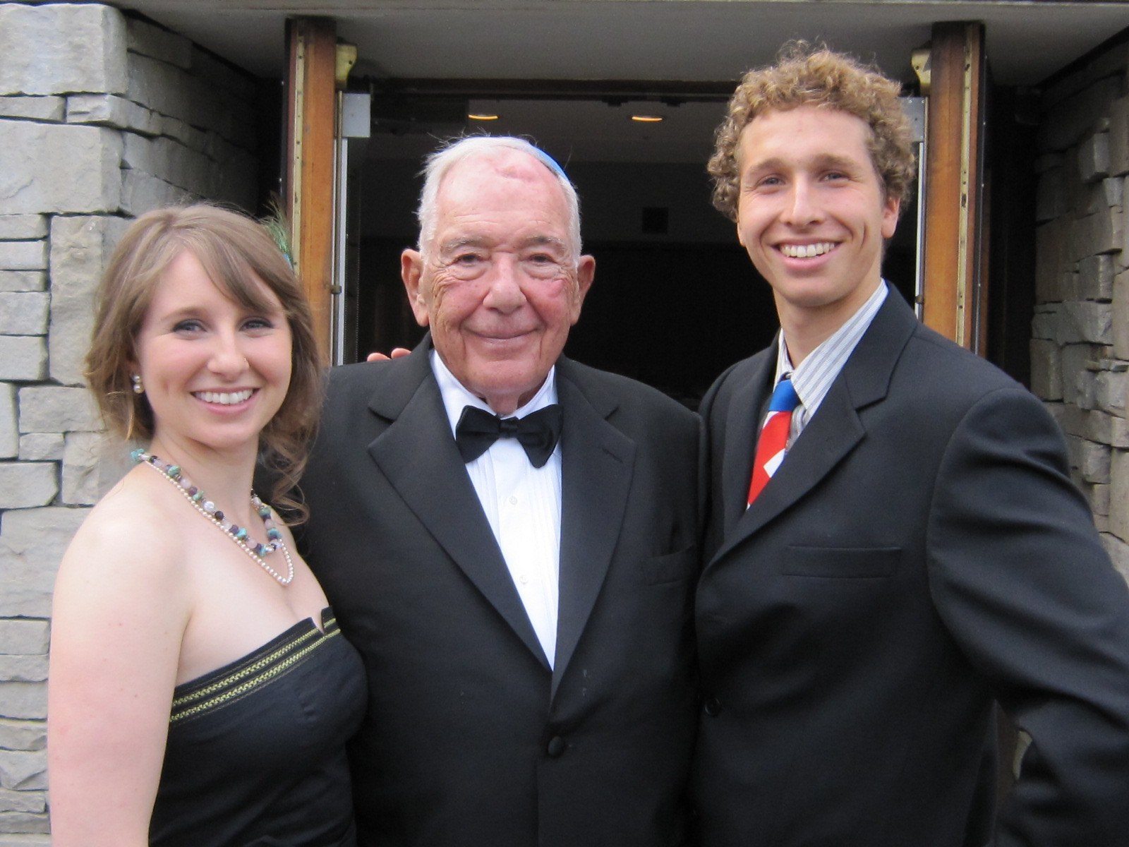 Irving Posluns with two of his grandchildren, Emma and Simon
